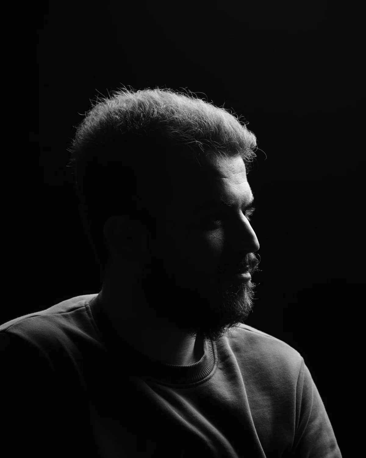 Black and white editorial portrait of Alex Antevski, Editor and VFX artist. STOCK PLACEHOLDER - swap with real team portrait.