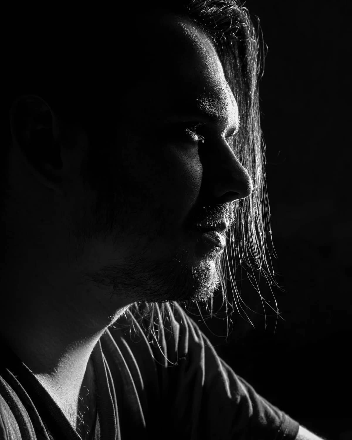 Black and white editorial portrait of Christian Foster, Visual Director for Set and Stage. STOCK PLACEHOLDER - swap with real team portrait.